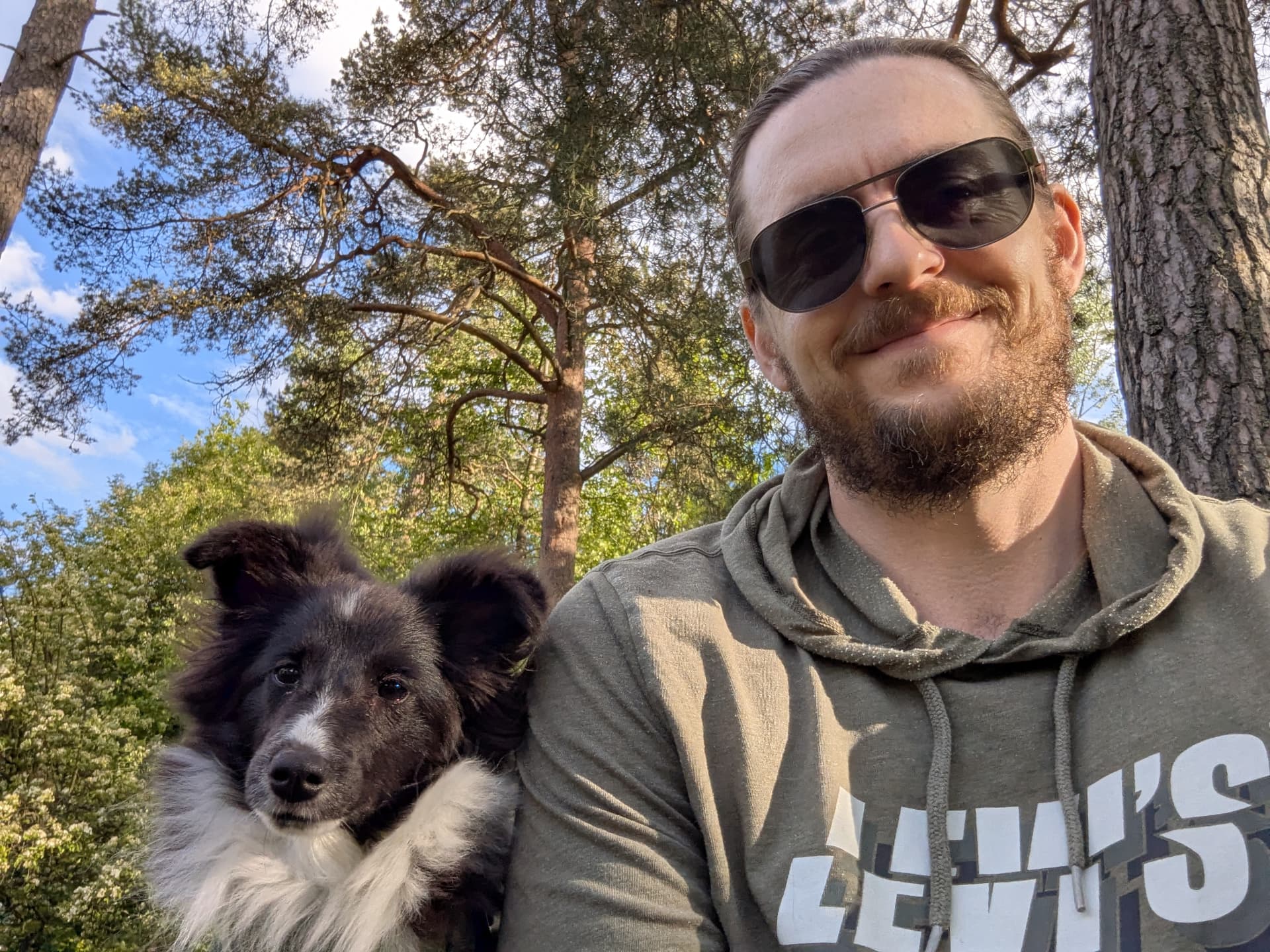 Jarryd Lacey with Dingo, his Shetland Sheepdog, in a Swedish forest